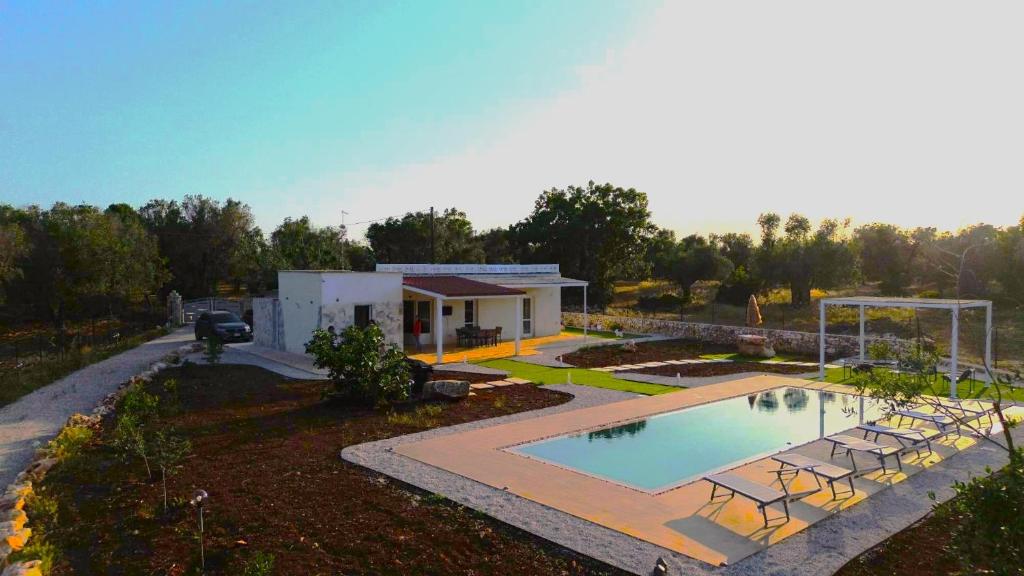 an aerial view of a house with a swimming pool at villa mastroronzo in San Michele Salentino