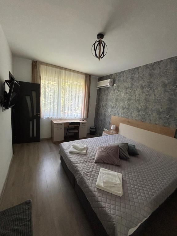 Postel nebo postele na pokoji v ubytování Alagen Apartments Burgas