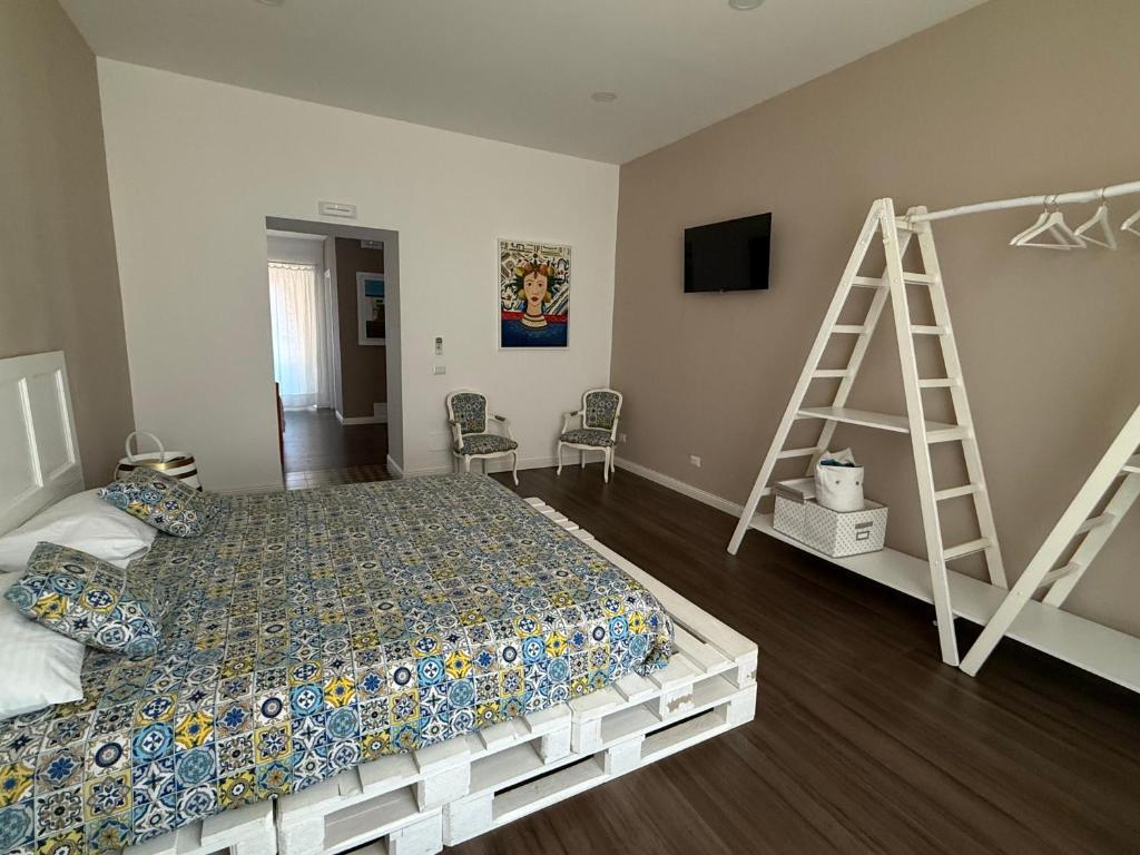 Posteľ alebo postele v izbe v ubytovaní Sikelia-sicilian rooms