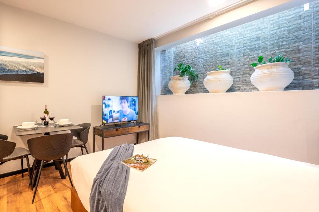 TV a/nebo společenská místnost v ubytování Sea Land Suites