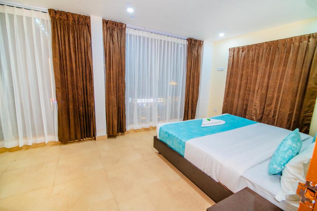 Postel nebo postele na pokoji v ubytování Hotel Shams Inn