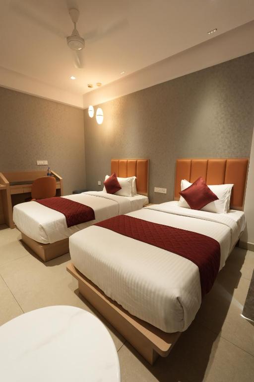 Postel nebo postele na pokoji v ubytování Hotel Cachet