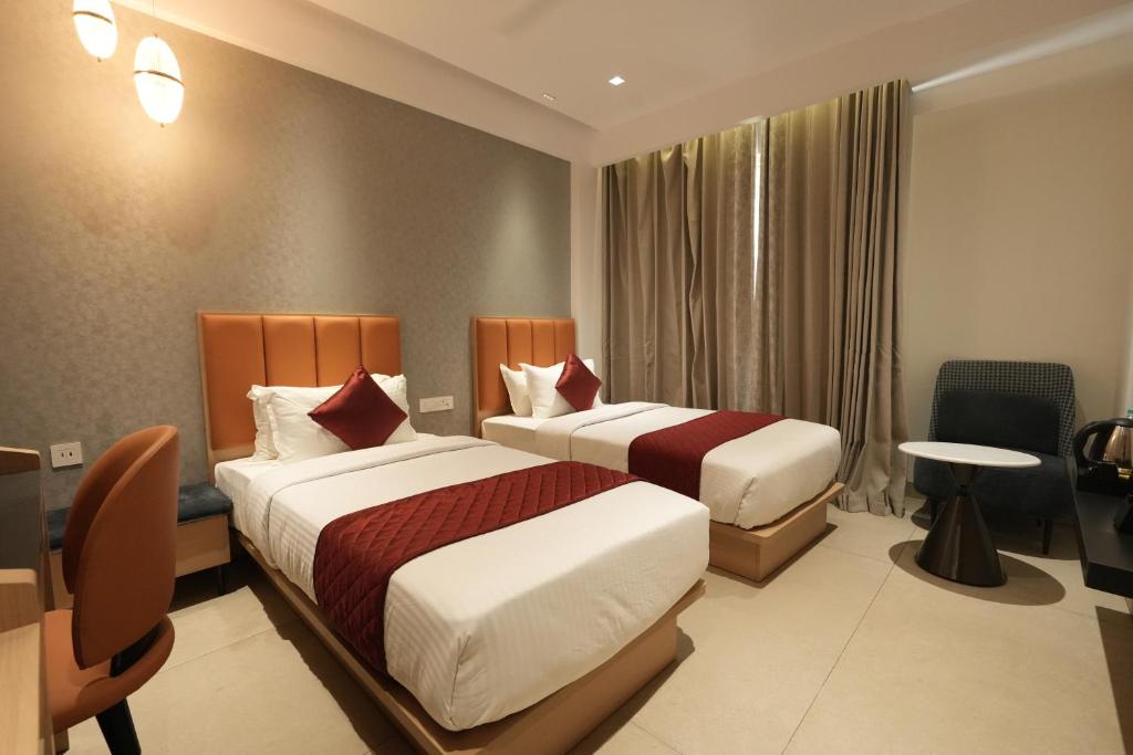 Postel nebo postele na pokoji v ubytování Hotel Cachet
