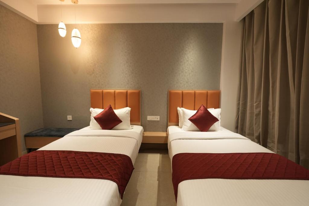 Postel nebo postele na pokoji v ubytování Hotel Cachet