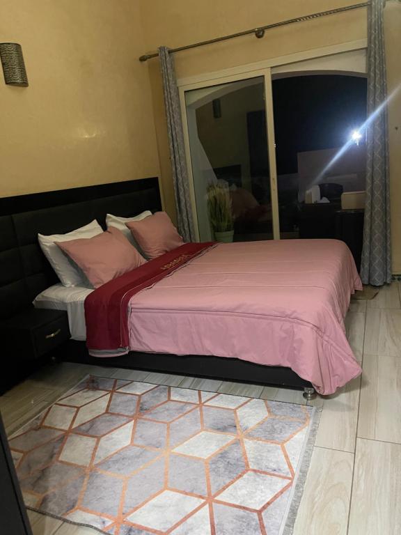 Voodi või voodid majutusasutuse Appartement vue sur mer toas