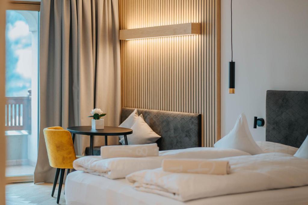 Postel nebo postele na pokoji v ubytování Small Hotel Sonne