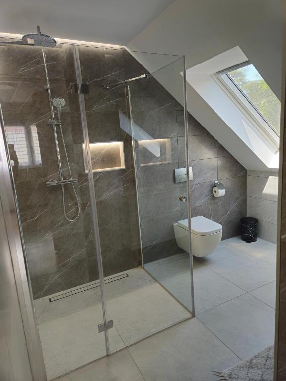 Łazienka w obiekcie Éva Apartman