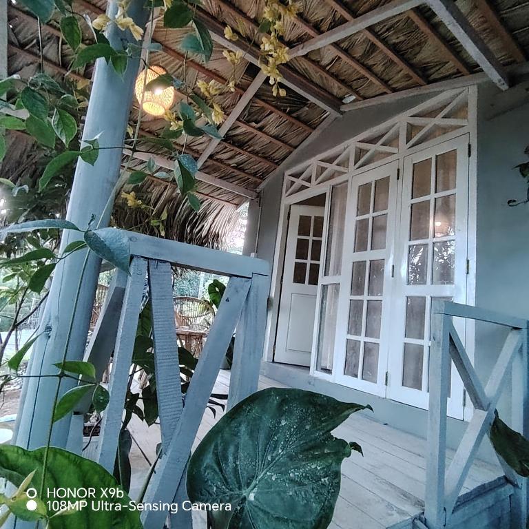 a house with a door and a window at Ella Ceylonka in Ella