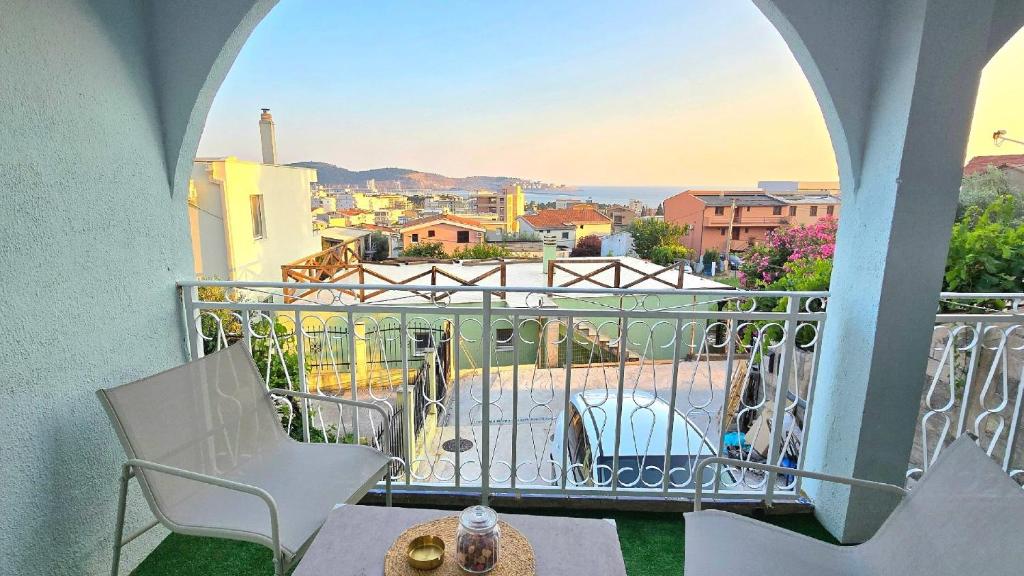 a balcony with chairs and a view of a city at Alpha Casa in Bar