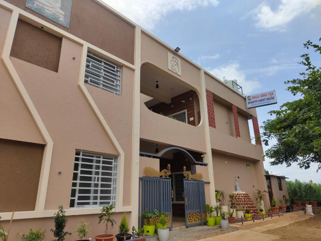 a building with the front of the building at Shanthi Guest House in Hampi