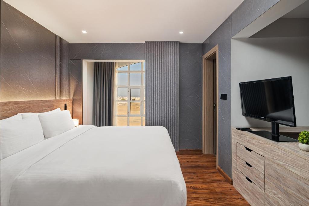 Postel nebo postele na pokoji v ubytování Regency Inn