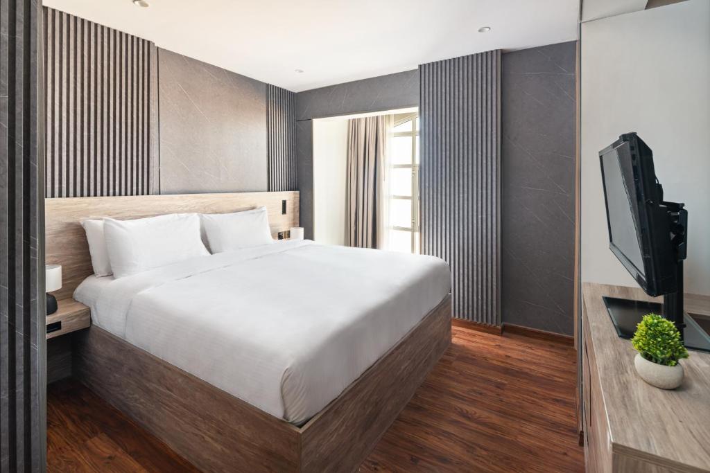 Postel nebo postele na pokoji v ubytování Regency Inn