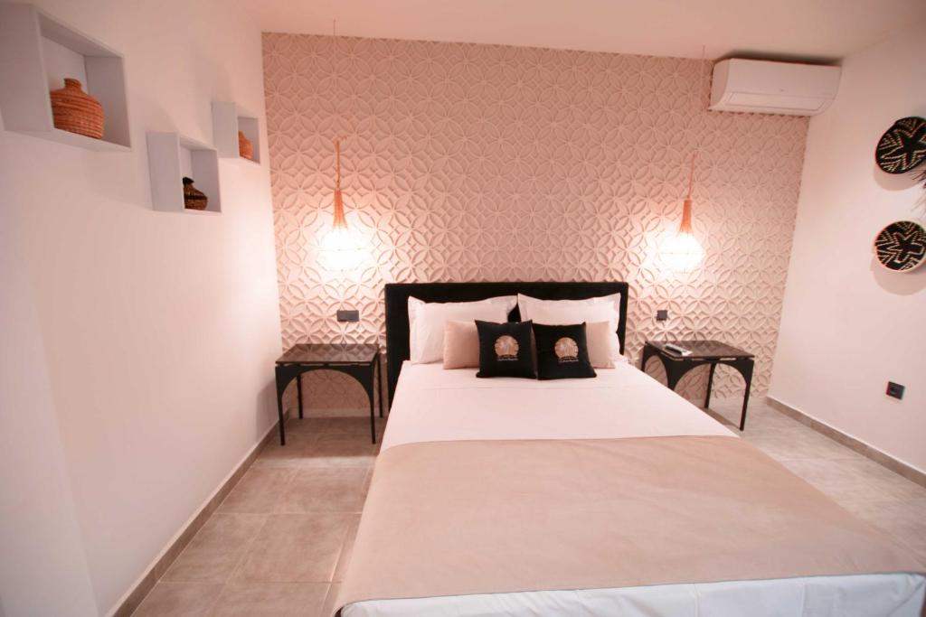 Postel nebo postele na pokoji v ubytování Riad La Petite Majorelle