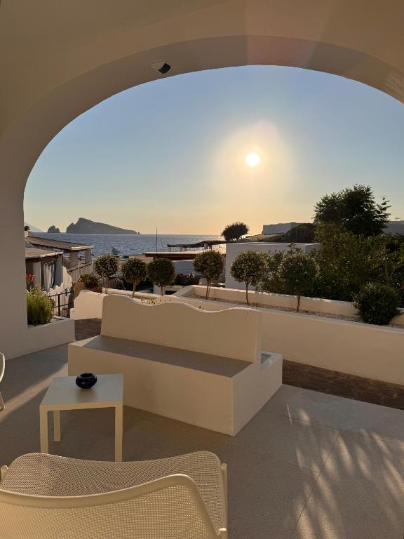 a living room with a view of the ocean at Kyma Suites in Panarea