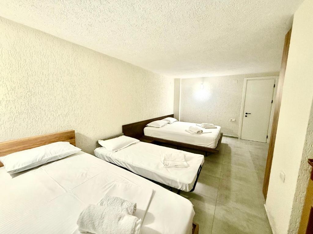 Postel nebo postele na pokoji v ubytování Hotel Barbare