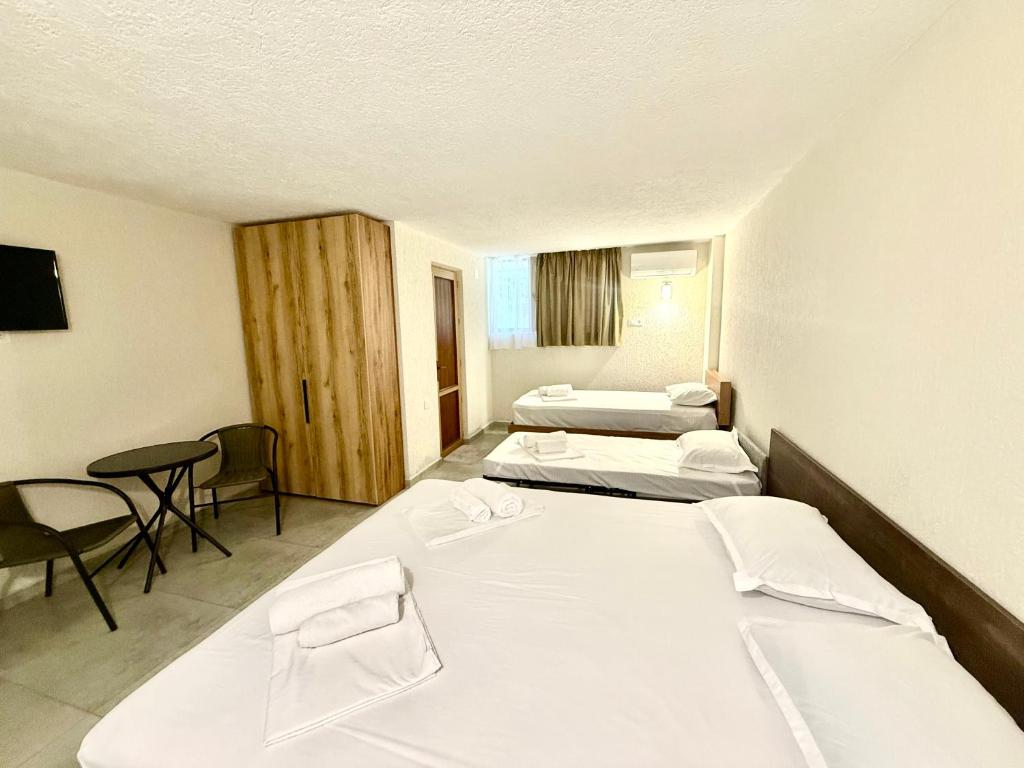 Postel nebo postele na pokoji v ubytování Hotel Barbare