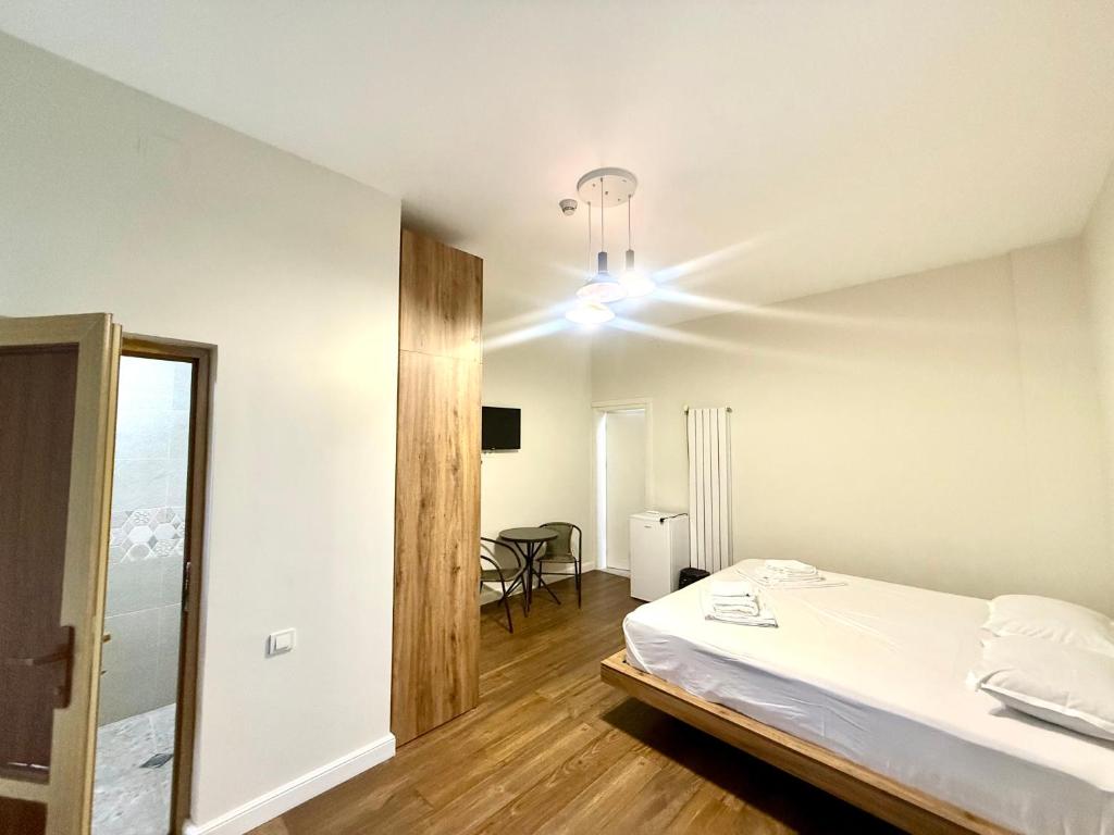 Postel nebo postele na pokoji v ubytování Hotel Barbare