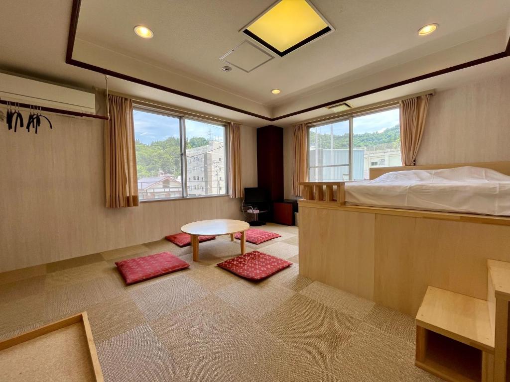 Postel nebo postele na pokoji v ubytování Yuzawa house2