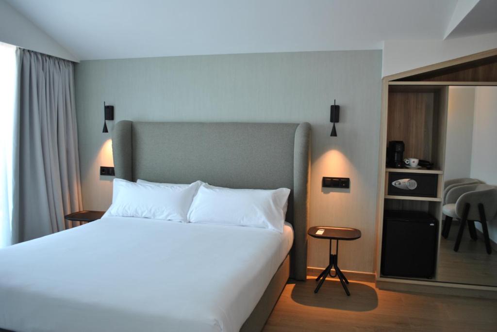Cama o camas de una habitación en Hotel Delfin Azul