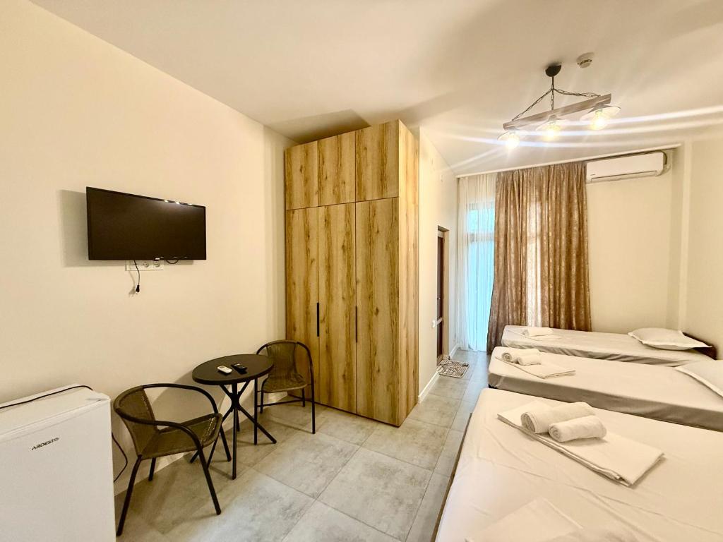 TV a/nebo společenská místnost v ubytování Hotel Barbare