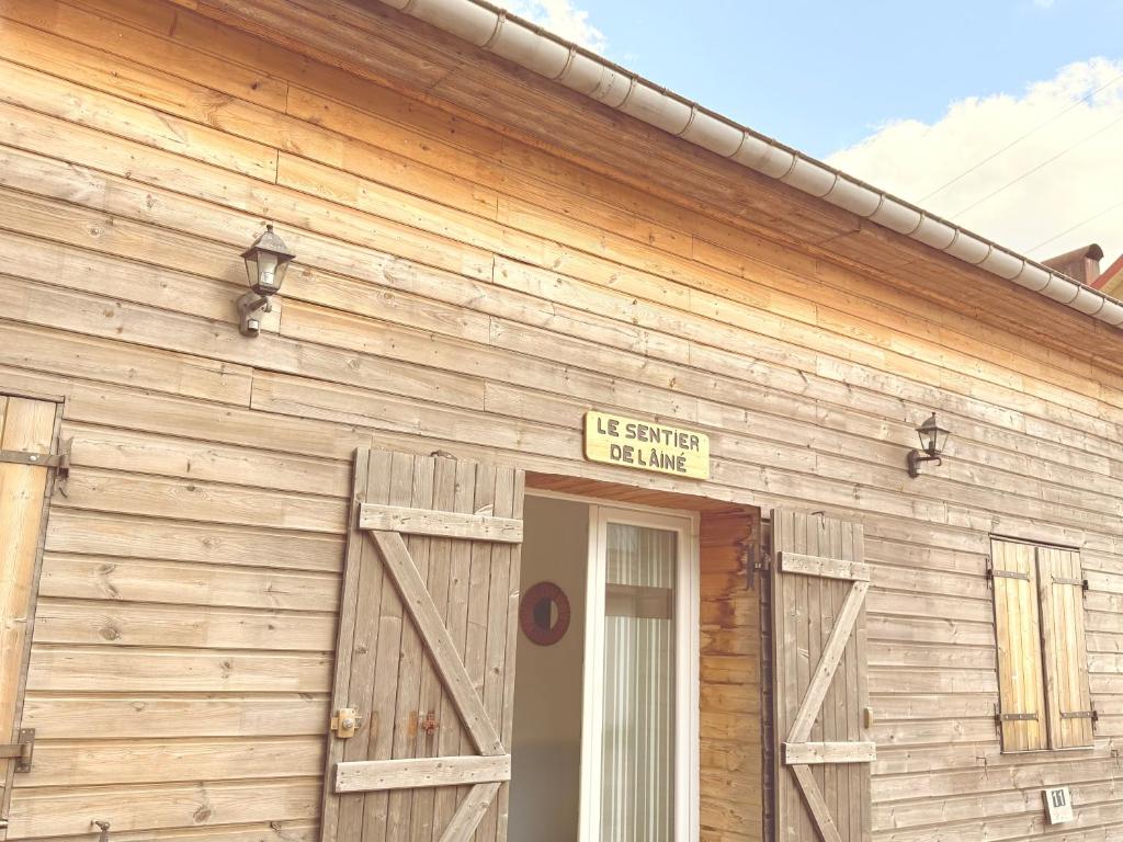 a building with a sign that reads its summer house at Grand apt La Bresse 6 a 8 pers centre et pistes proches in La Bresse