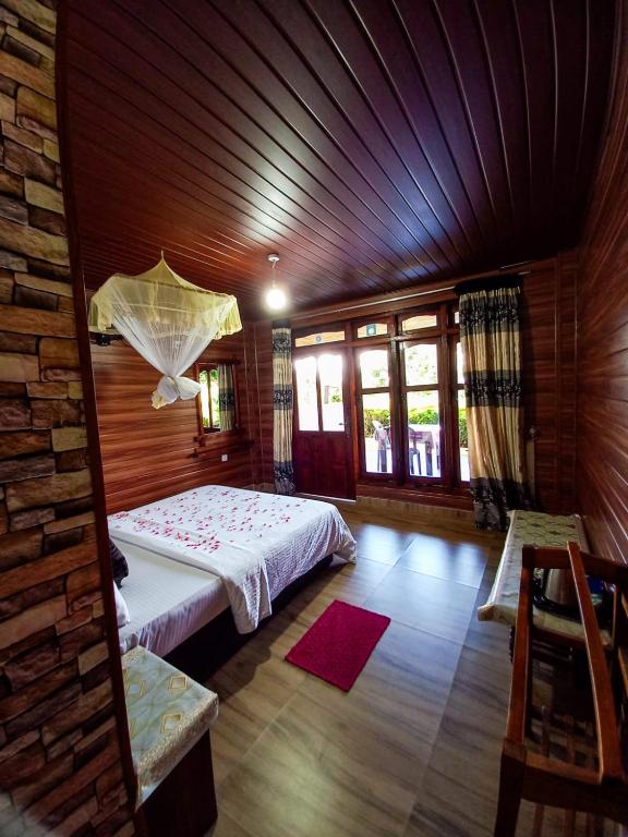 Postel nebo postele na pokoji v ubytování Ella Happy View Homestay
