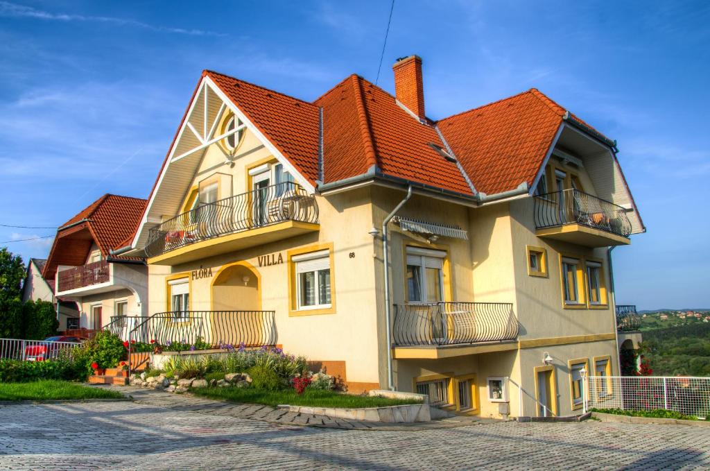 a large house with an orange roof at Flora Villa in Hévíz