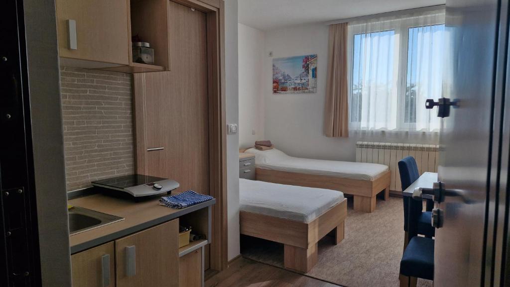 a hospital room with a bed and a sink at Banjica 202 in Voždovac