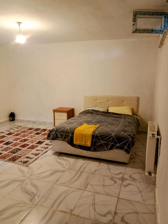 a bedroom with a bed in the corner of a room at The cheapest room closest to Istanbul airport in Arnavutköy