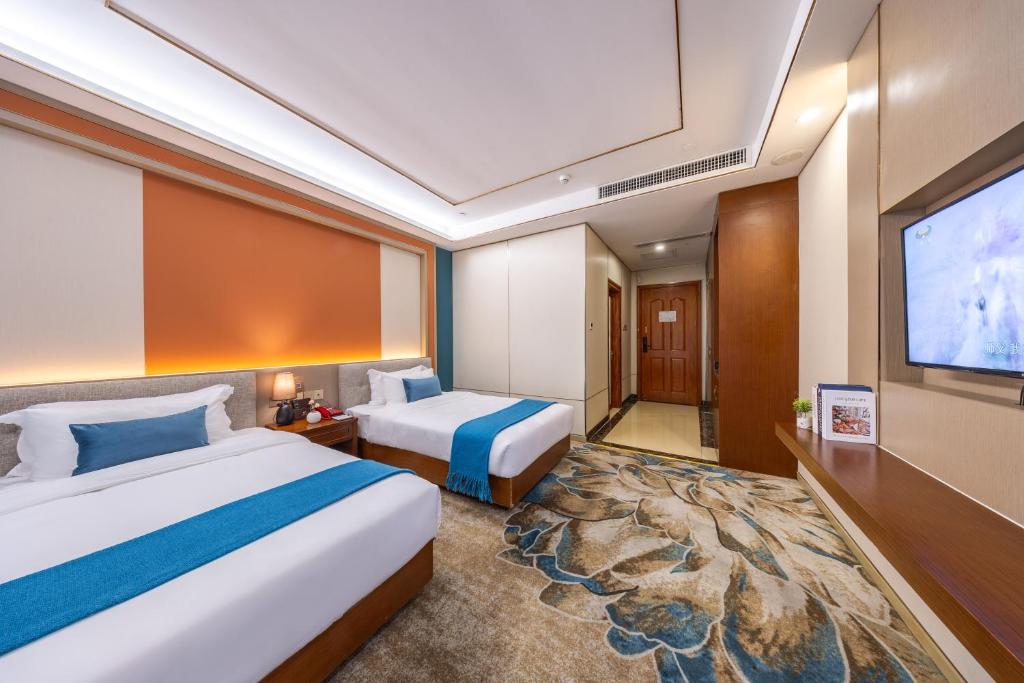 Katil atau katil-katil dalam bilik di Shenzhen New Runhua Hotel Guangmingcheng Station Hongqiao Park Branch