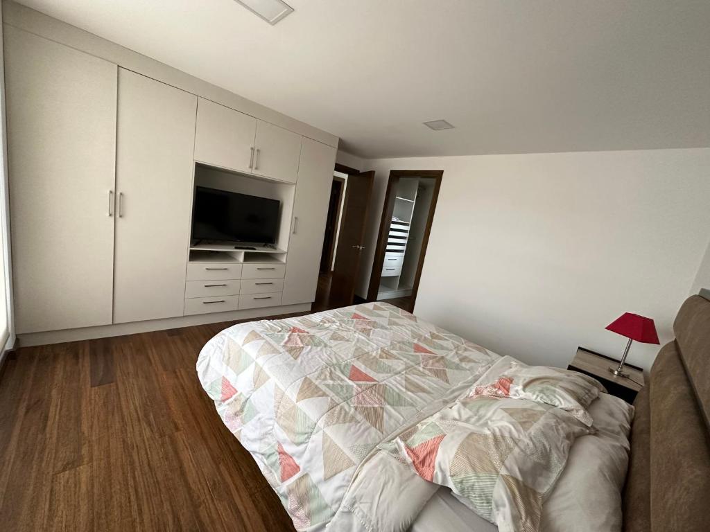Postel nebo postele na pokoji v ubytování Instant Hotel - Departamentos de lujo en Ambato