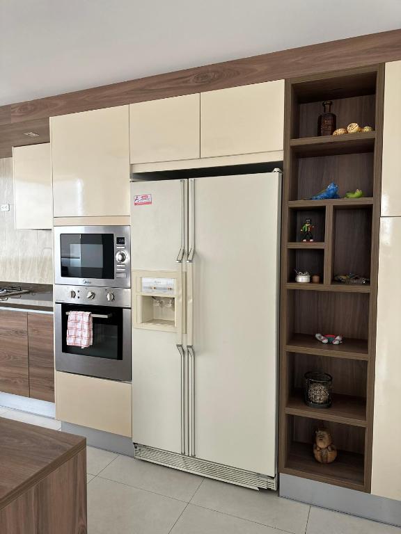 Kuchyň nebo kuchyňský kout v ubytování Instant Hotel - Departamentos de lujo en Ambato