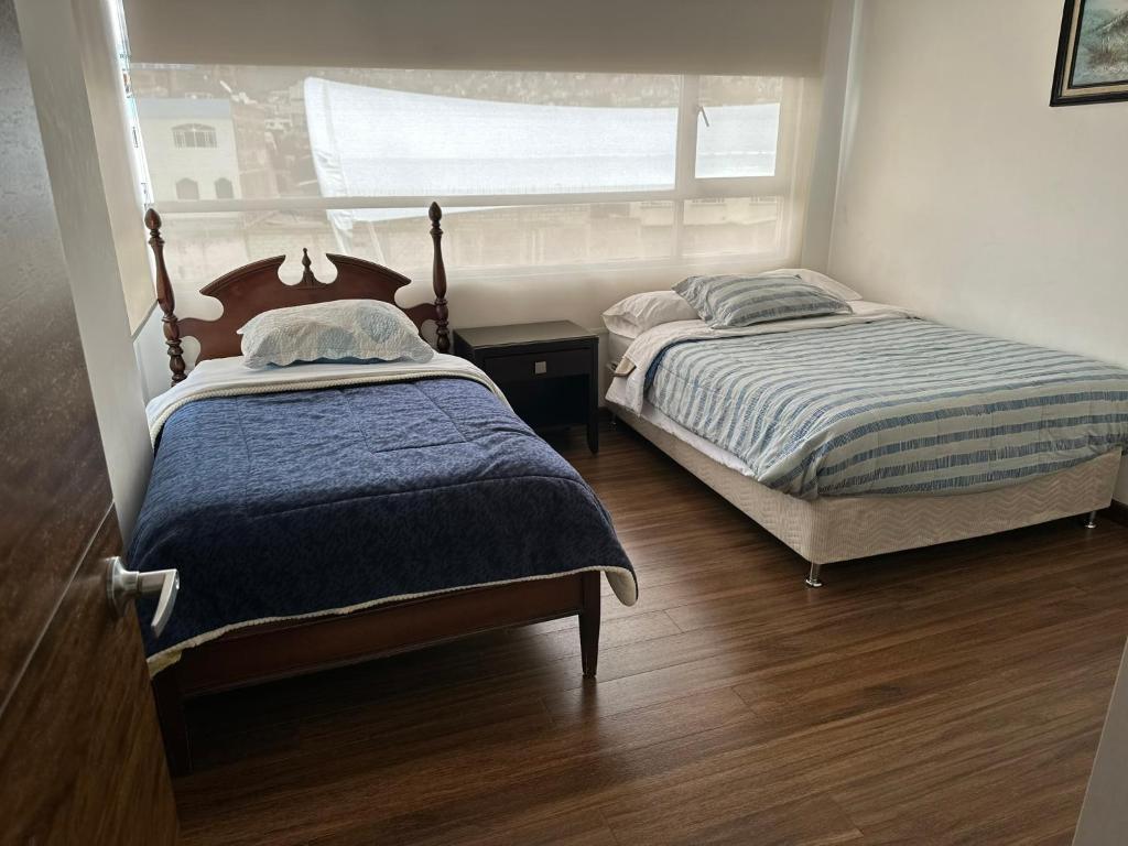 Postel nebo postele na pokoji v ubytování Instant Hotel - Departamentos de lujo en Ambato