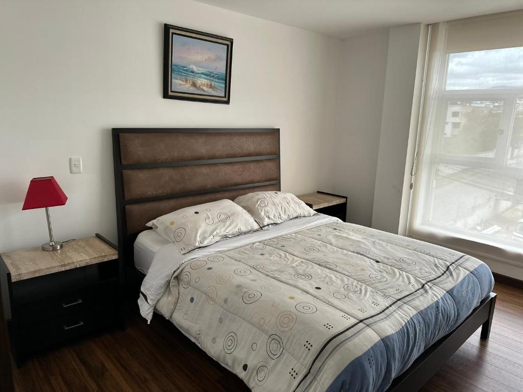Postel nebo postele na pokoji v ubytování Instant Hotel - Departamentos de lujo en Ambato