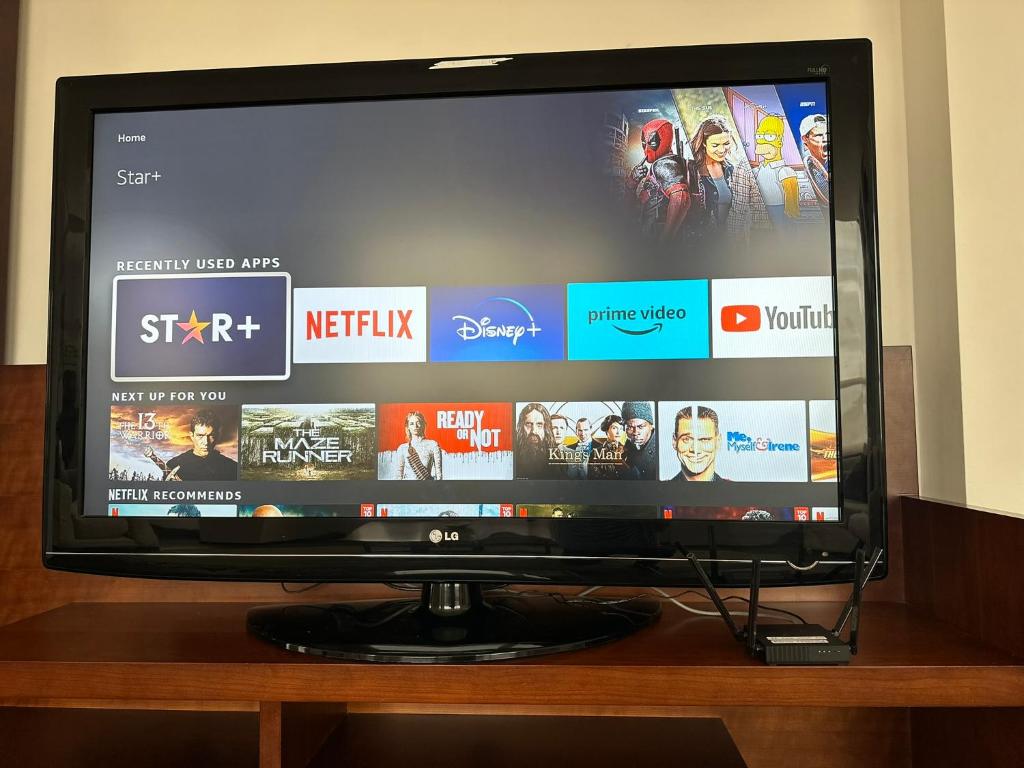TV a/nebo společenská místnost v ubytování Instant Hotel - Departamentos de lujo en Ambato