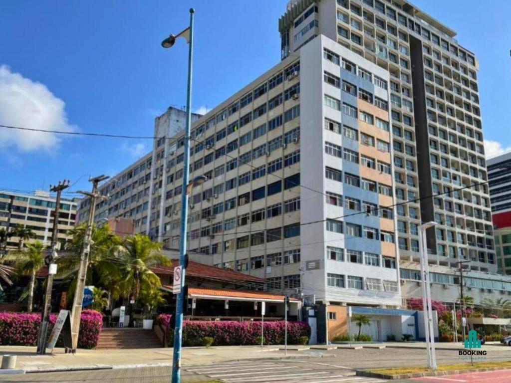 a large building with a bus in front of it at Jacqueline Vista Mar by Holiday Stays in Fortaleza