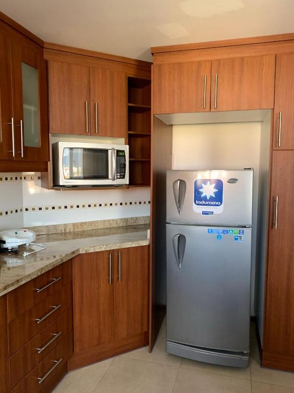 Kuchyň nebo kuchyňský kout v ubytování Instant Hotel - Departamentos de lujo en Ambato