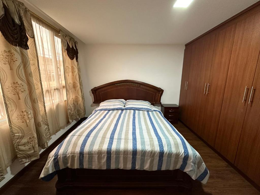 Postel nebo postele na pokoji v ubytování Instant Hotel - Departamentos de lujo en Ambato