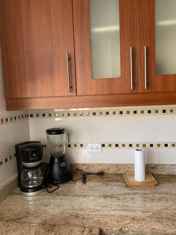 Kuchyň nebo kuchyňský kout v ubytování Instant Hotel - Departamentos de lujo en Ambato