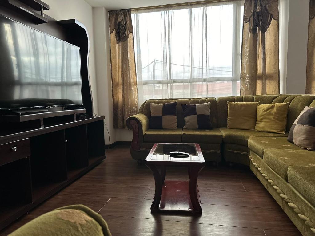 Posezení v ubytování Instant Hotel - Departamentos de lujo en Ambato