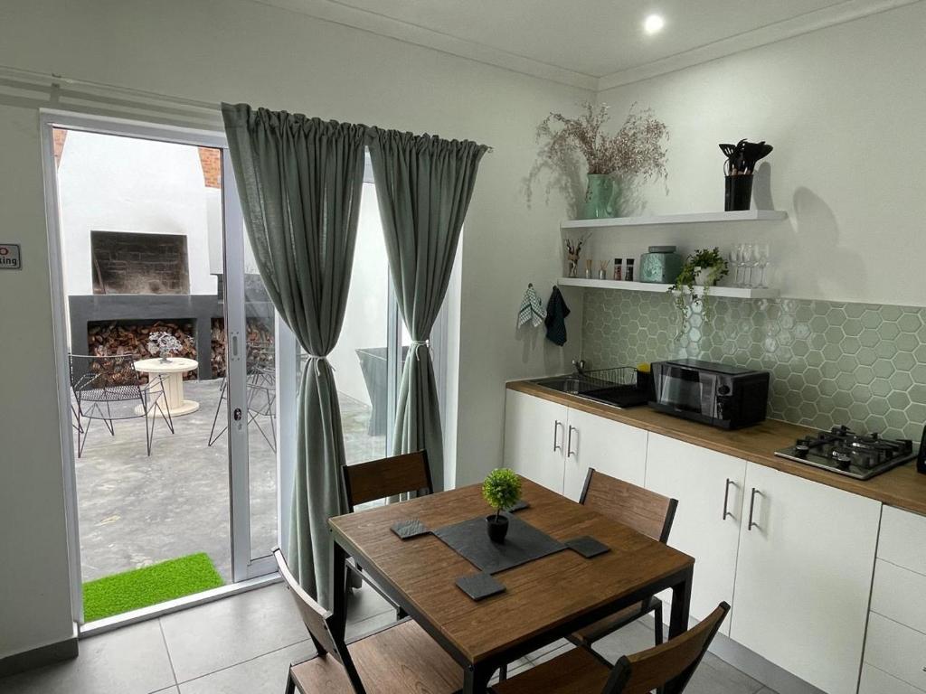 Kuchyň nebo kuchyňský kout v ubytování 14 on Botha