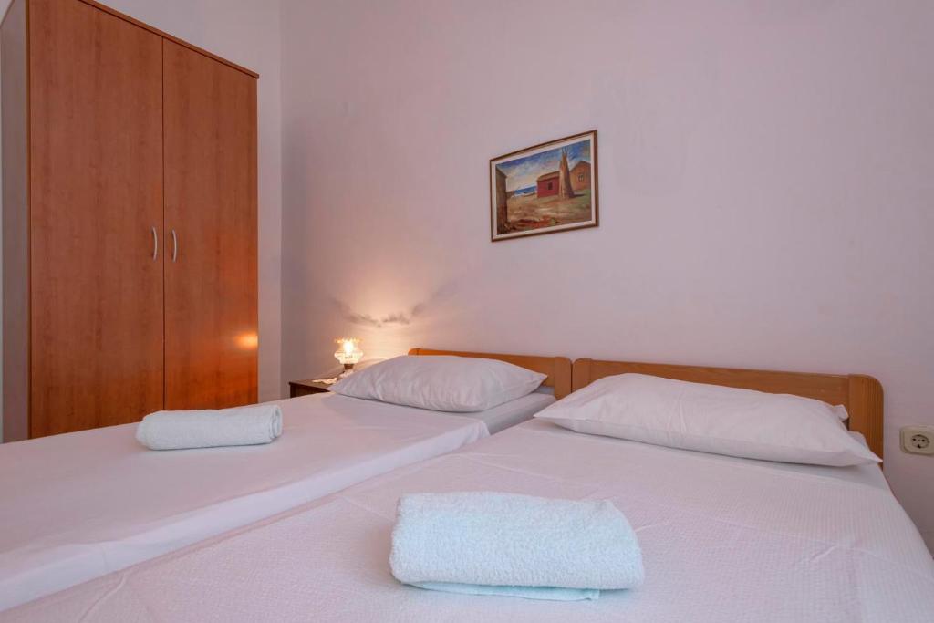Postel nebo postele na pokoji v ubytování Apartments Zora