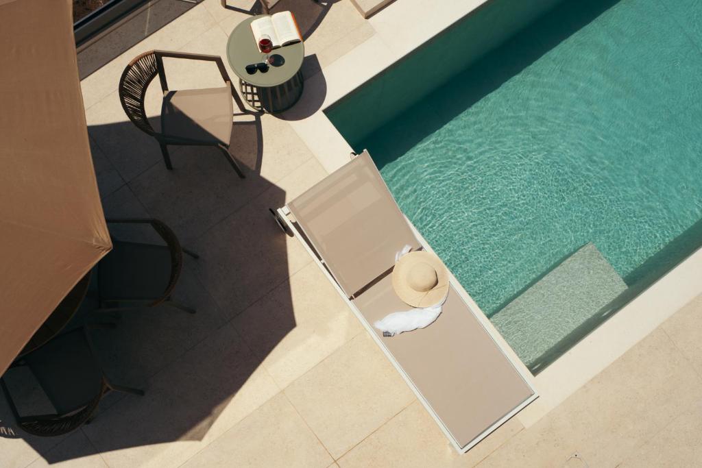 an overhead view of a swimming pool with a hat at DK Luxury Villas in Syvota