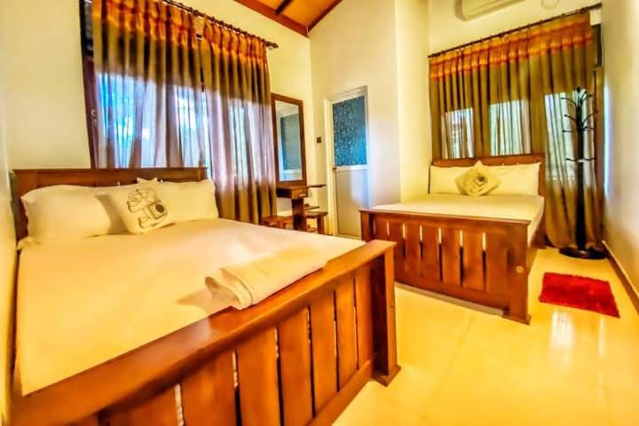 Postel nebo postele na pokoji v ubytování Harambathenna Resort Anuradhapura