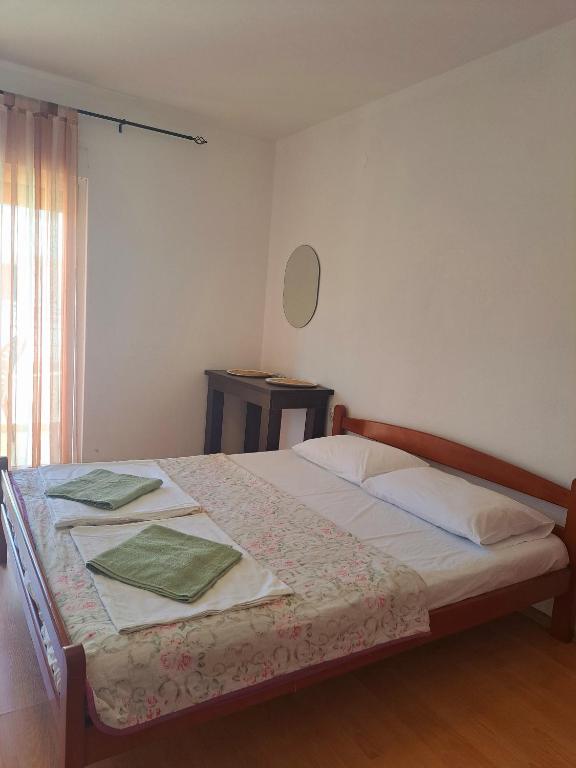 Postel nebo postele na pokoji v ubytování Lazorja Rooms