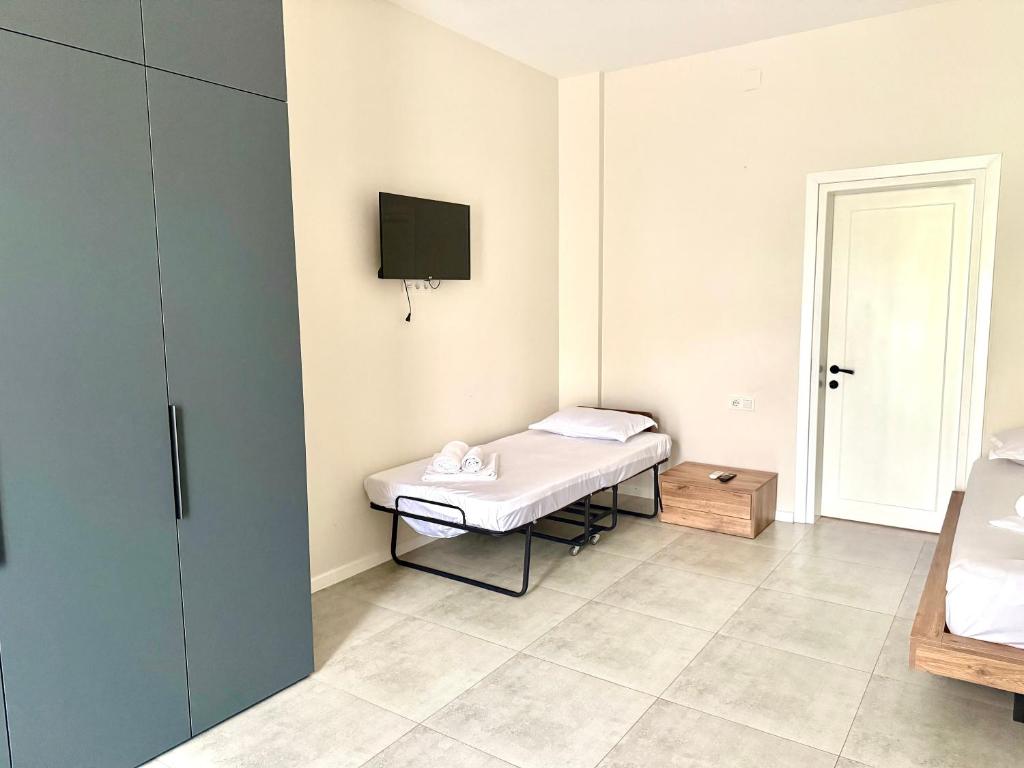 Postel nebo postele na pokoji v ubytování Hotel Barbare