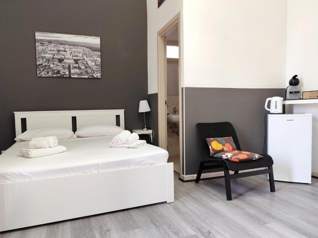 Postel nebo postele na pokoji v ubytování DUCEZIO rooms