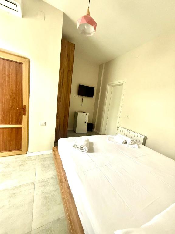 Postel nebo postele na pokoji v ubytování Hotel Barbare