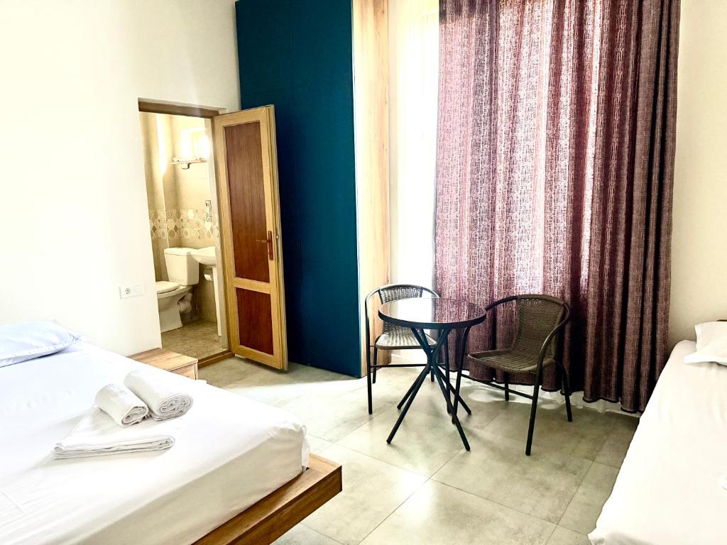 Postel nebo postele na pokoji v ubytování Hotel Barbare