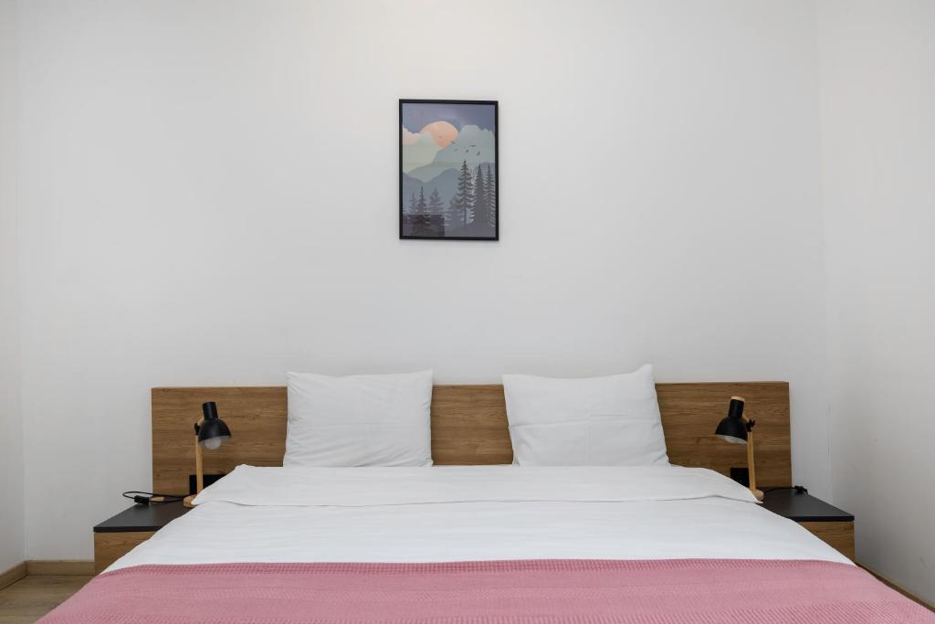 Postel nebo postele na pokoji v ubytování 3100 Boutique Hotel Kazbegi